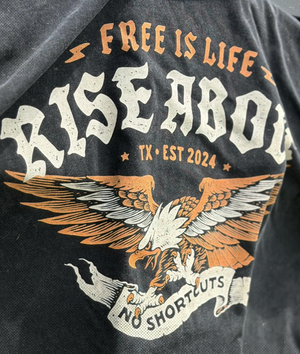 Black t-shirt with 'Free is Life, Rise Above' text and eagle design.